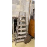 A vintage seven tread wooden step ladder, height 160cm together with a vintage baker's bread paddle