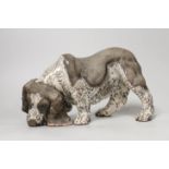 Keza Rudge (British 20th Century), a pottery model of a sniffing spaniel, signed. 29cm wide