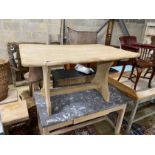 A Provincial bleached oak rectangular waney edge tavern type table, width 136cm, depth 92cm,