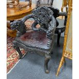 A pair of early 20th century Chinese carved elbow chairs, width 64cm, depth 46cm, height 83cm