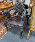 A pair of early 20th century Chinese carved elbow chairs, width 64cm, depth 46cm, height 83cm