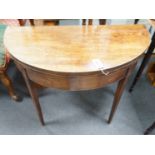 A George III mahogany and boxwood strung D shaped folding card table, width 91cm, depth 45cm, height