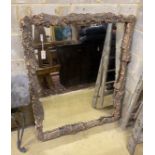 A rectangular cork framed wall mirror, width 108cm, height 134cm