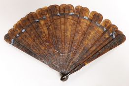 A 19th century Chinese tortoiseshell Brise fan, decorated with a central figural cartouche, 18.