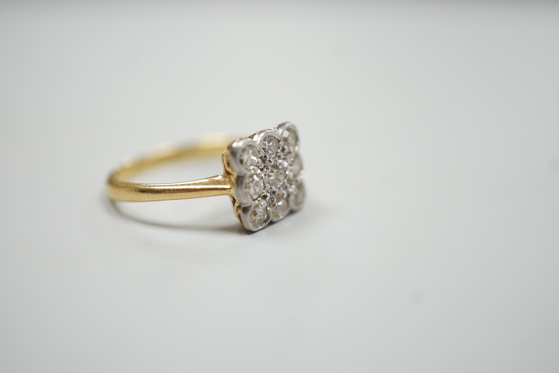 An 18ct and collet set nine stone diamond cluster table ring, size K/L, gross weight 2.6 grams. - Image 3 of 4