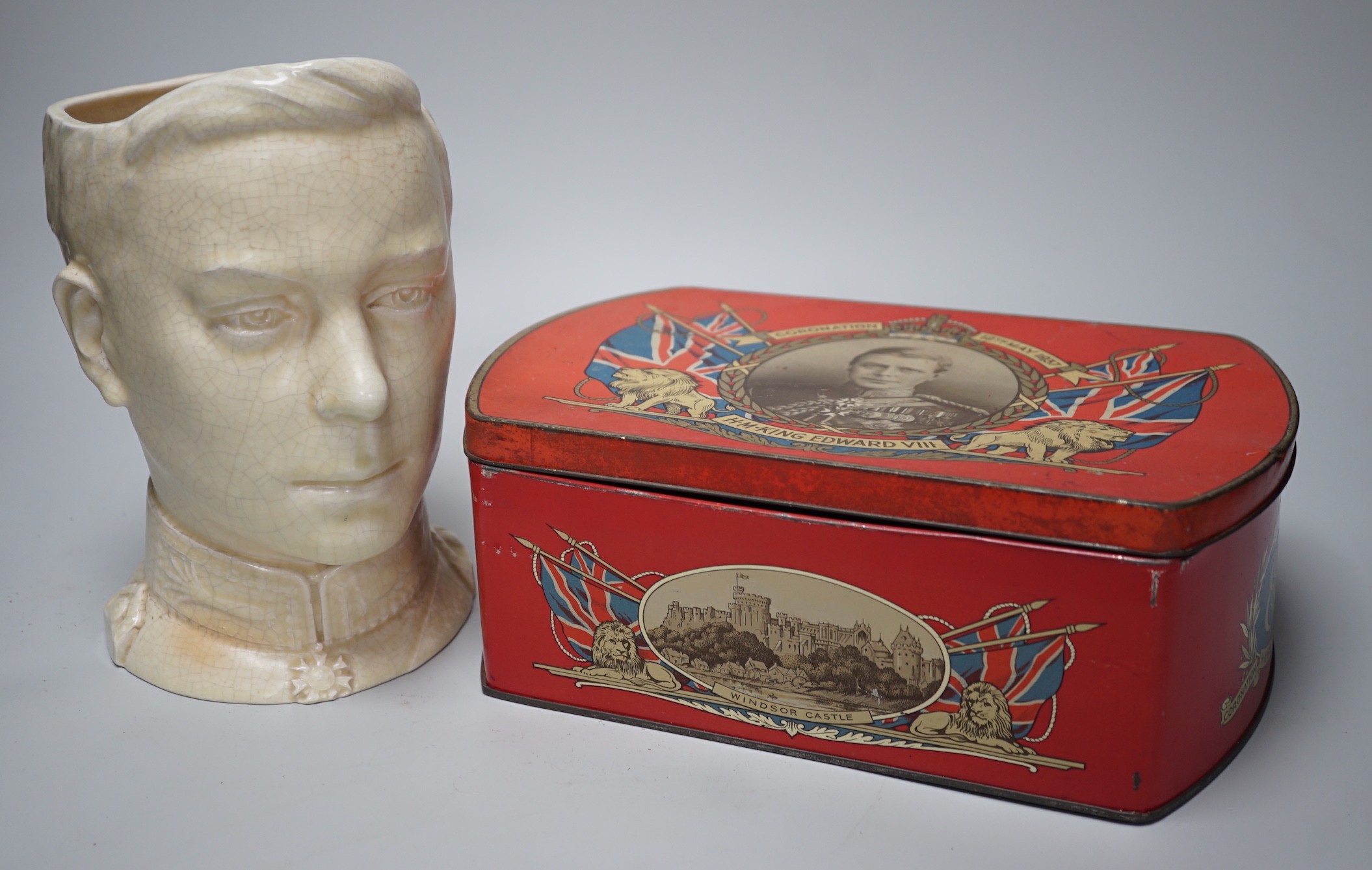 A musical Edward VII Coronation jug playing ' God save the King' and an Edward VIII biscuit tin