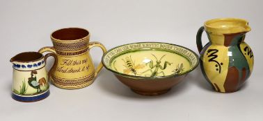 Margaret Brompton studio pottery bowl with insects, together with a slipware jug, a Longpark,