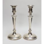 A pair of early 19th century Old Sheffield plate candlesticks. 28cm high