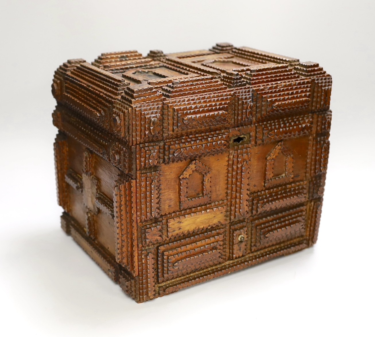 A late 19th century Tramp art elaborately chip-carved wood casket. 24cm high