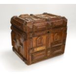 A late 19th century Tramp art elaborately chip-carved wood casket. 24cm high