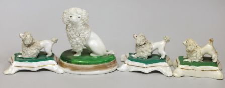 Four small Staffordshire models of poodles, c.1830-50. Tallest 7cms highProvenance Dennis G.Rice