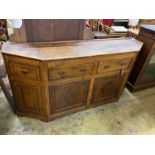 An unusual George III oak breakfront low dresser, length 177cm, depth 48cm, height 87cm