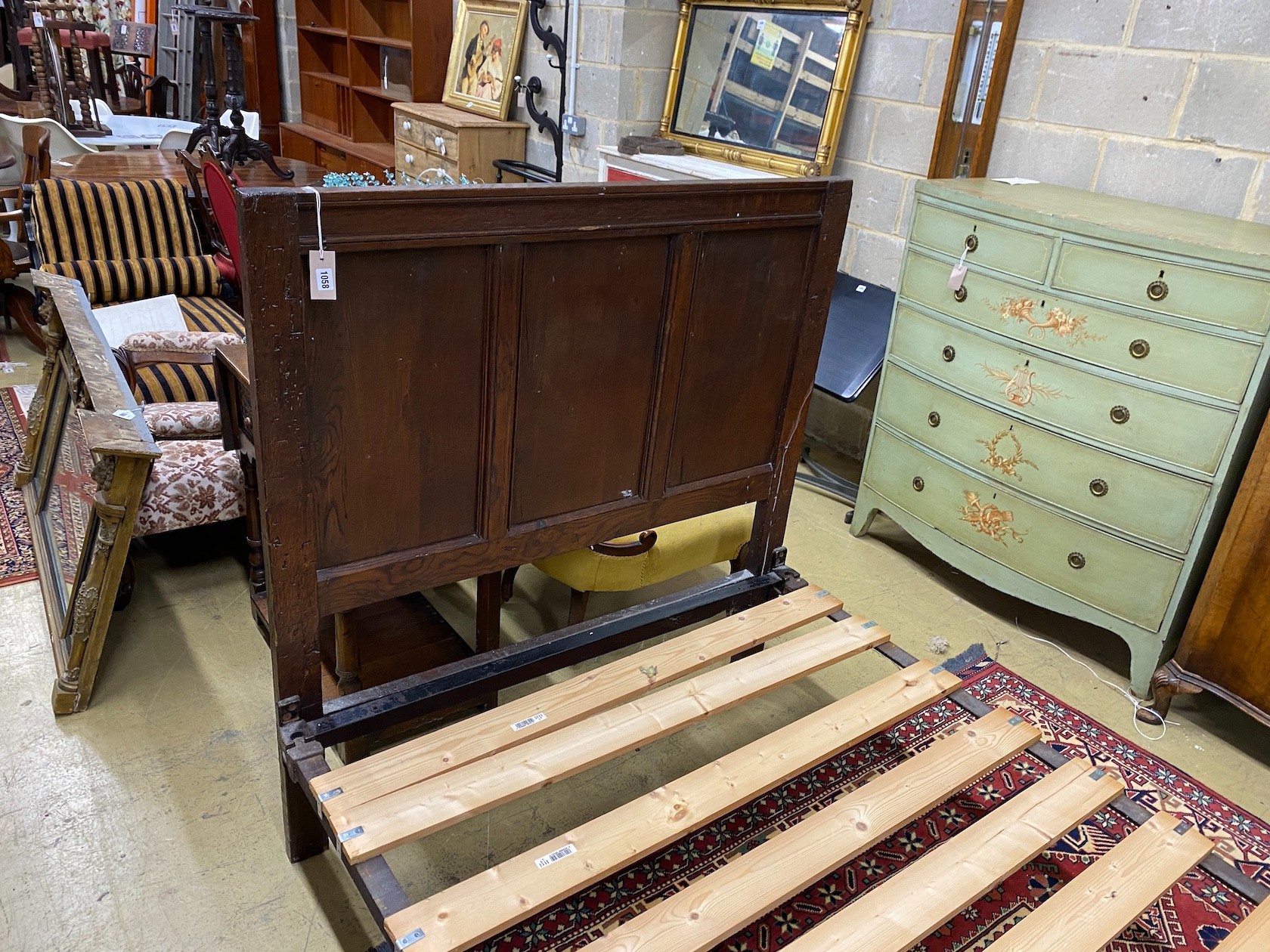 An 18th century style panelled oak bedframe, length 198cm, width 122cm, height 130cm - Image 2 of 3