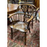 A near pair of 19th century Lincolnshire ash and elm Windsor elbow chairs, width 55cm, depth 38cm,