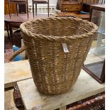 A rustic wicker grape hod, width 65cm, height 63cm