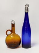 A blue glass hock bottle with George IV silver stopper and an amber glass spirit flask with