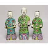 A near pair of Chinese polychrome-decorated figural incense burners and another similar incense