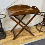 A 19th century mahogany butler’s tray on folding stand, width 68cm, depth 46cm, height 80cm