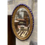 An Irish style oval wall mirror, width 64cm, height 100cm