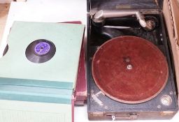 An HMV tabletop wind up gramaphone and records