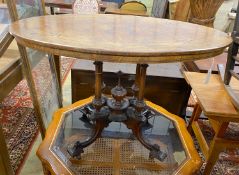 A Victorian inlaid walnut oval centre table, width 107cm, depth 64cm, height 72cm