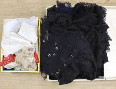 A suitcase of mixed 19th and 20th century black machine and bobbin laces, servants bonnets, cream