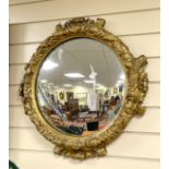 A 19th century circular and giltwood composition wall mirror, diameter 60cm