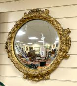 A 19th century circular and giltwood composition wall mirror, diameter 60cm