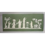 A large early 19th century Wedgwood green jasper plaque with classical reliefs, impressed mark