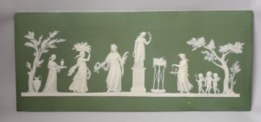 A large early 19th century Wedgwood green jasper plaque with classical reliefs, impressed mark