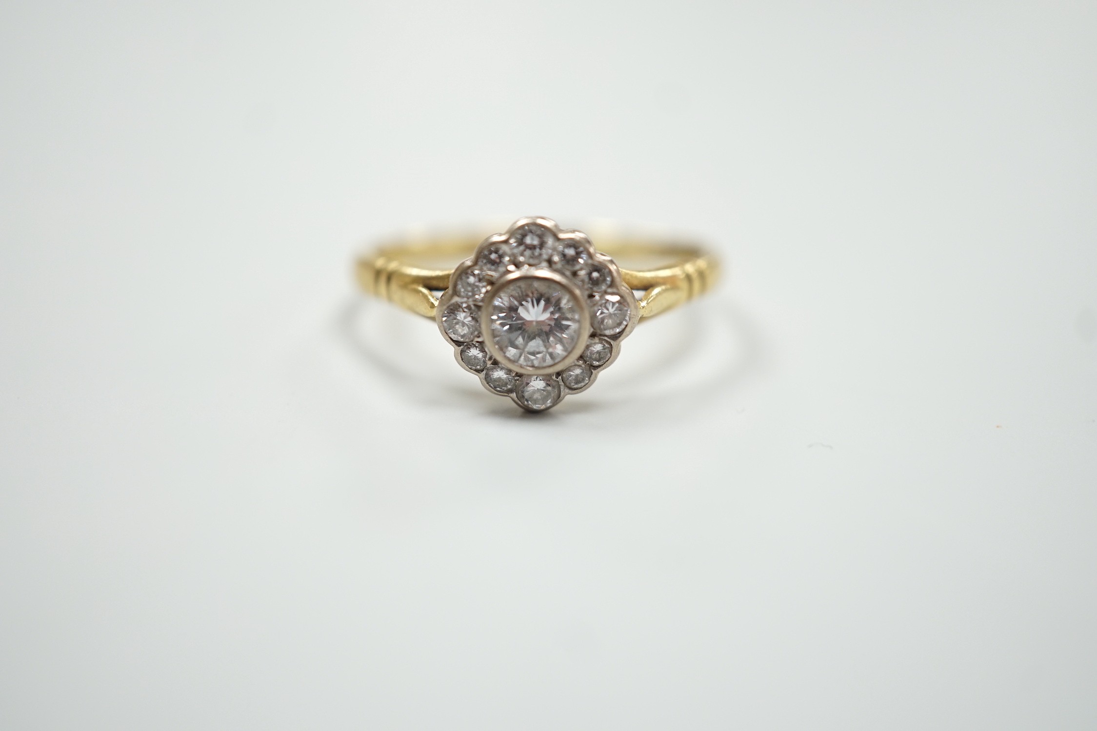 A modern 18ct gold and single stone diamond ring, with diamond set border, size S, gross weight 3. - Image 2 of 5