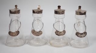A set of four Edwardian silver mounted glass whisky noggins, H.B. Johnson & Co, Birmingham, 1909,