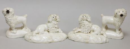 Two pairs of small Staffordshire models of poodles; one pair recumbent and the other standing, c.