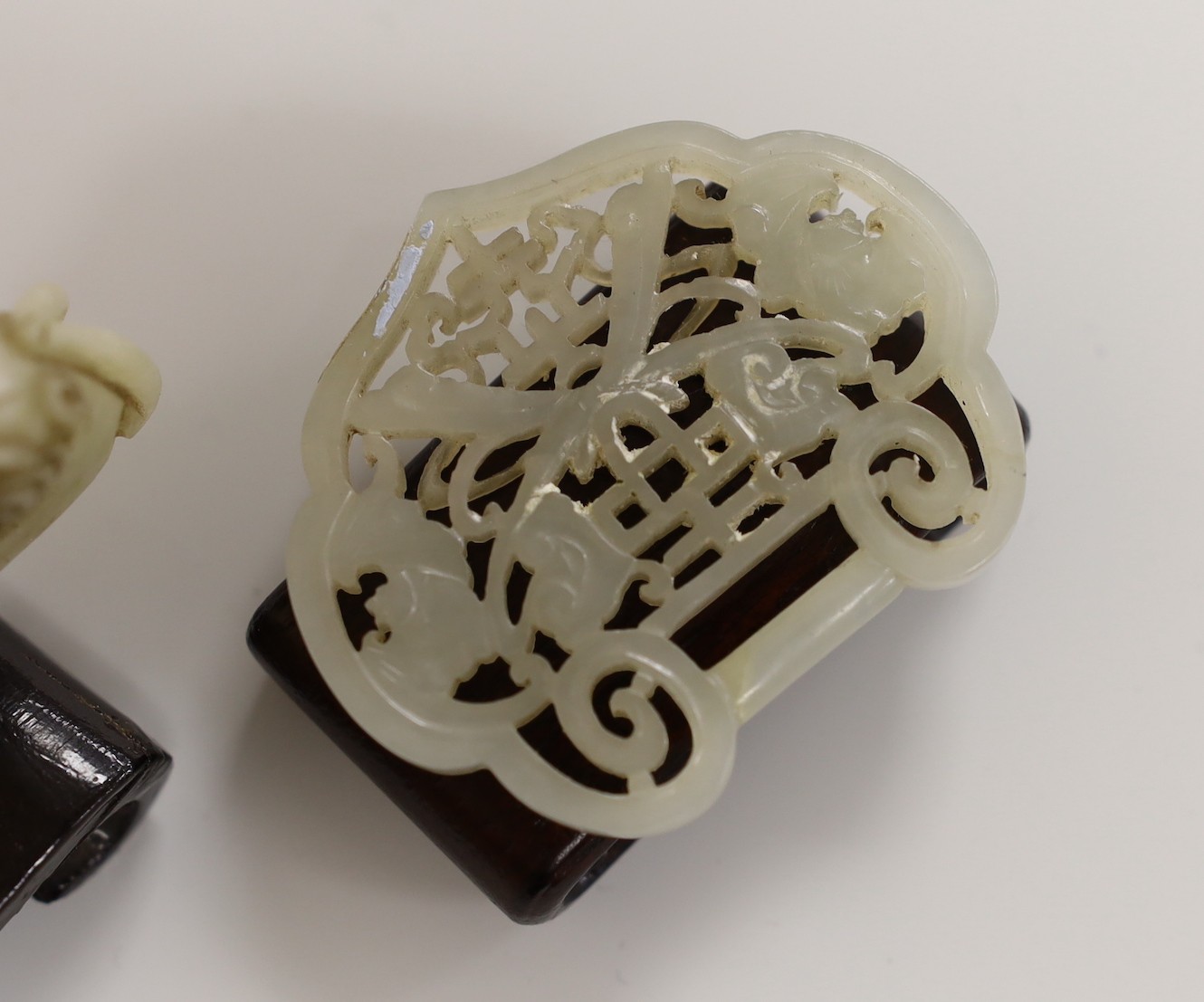 A Chinese jade belt hook and a spirit lock, belt hook, both 19th centur, 8cms wide - Image 2 of 3