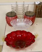 An abstract glass plant pot holder, together with a pair of cranberry glass jars and covers, etc.