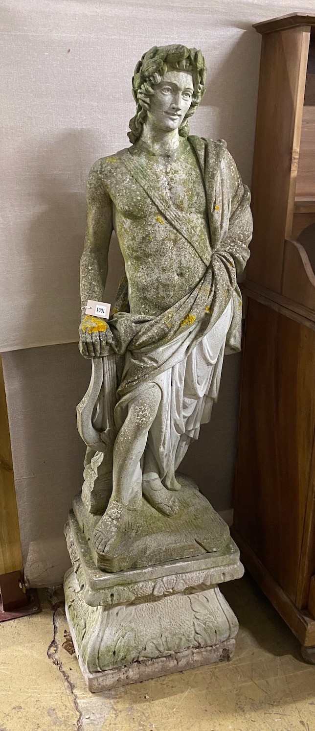 A reconstituted stone garden ornament, robed classical figure with lyre on square plinth height