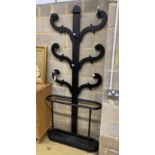 A Victorian hall stand with tin drip tray, later painted black, width 90cm, height 215cm