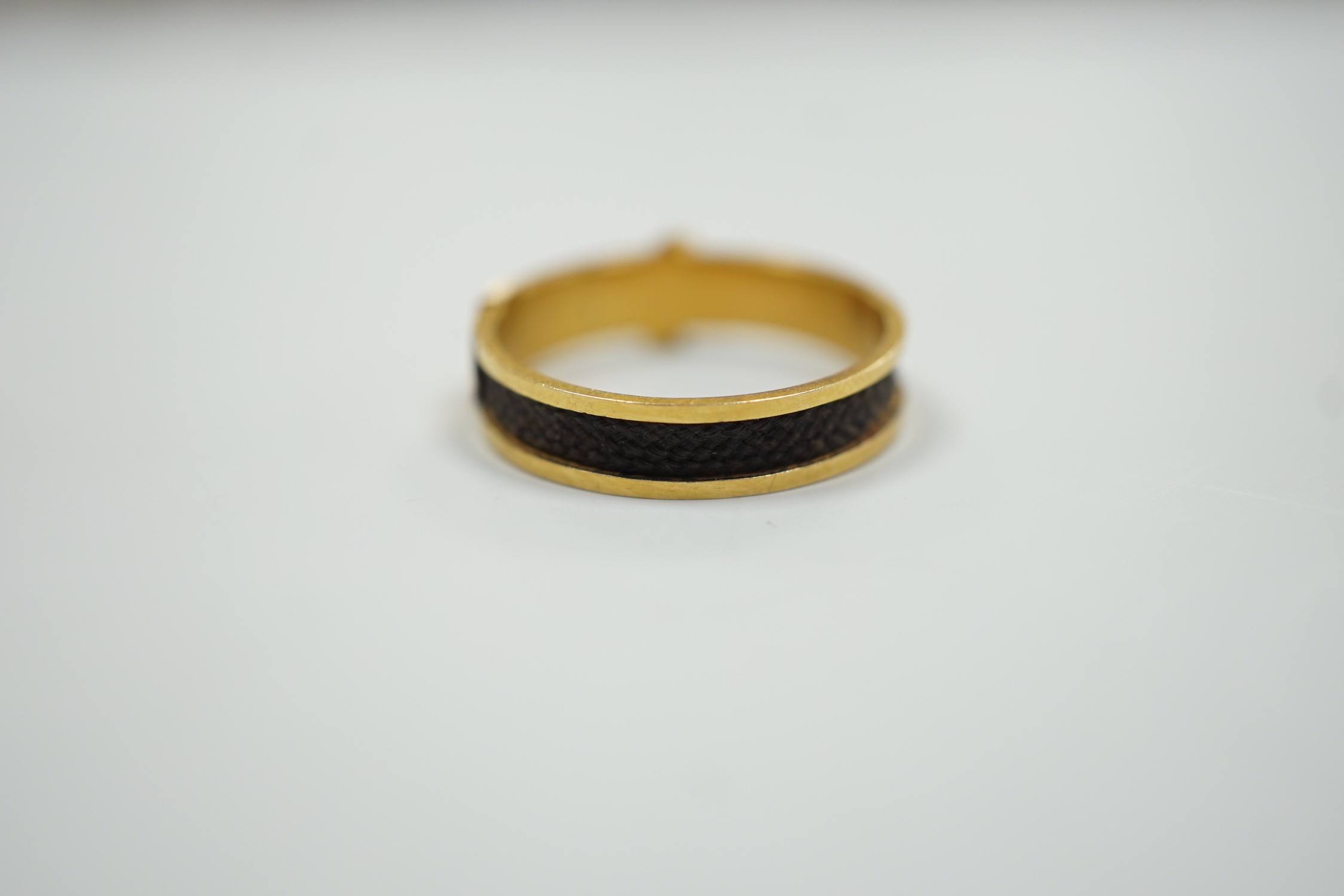 A 19th century yellow metal and plaited hair mourning band, modelled as a buckle, the shank interior - Image 3 of 6