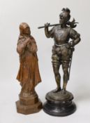 A 19th century carved wood figure of the ‘Virgin of Nuremberg’ together with a spelter figure of a