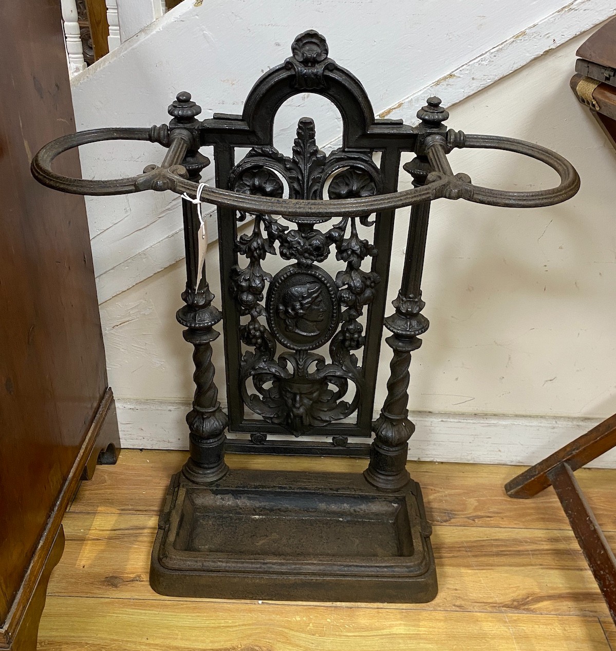 A Victorian Coalbrookdale style cast iron stick stand, width 59cm, height 72cm