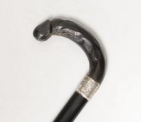 A silver mounted ebony cane with a phallic shaped handle, presented by N.D.T. Chapel to W.H.