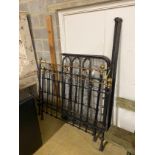 A Victorian cast iron and brass mounted bed frame, width 136cm, height 130cm