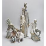 A group of four Lladro figures. Tallest 50cm