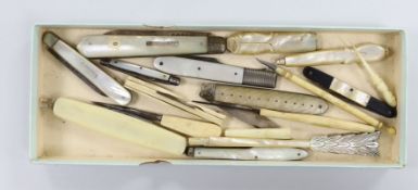 A group of silver and steel bladed pocket folding knives