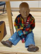 An unusual vintage shop dummy of a seated young boy, 53cm