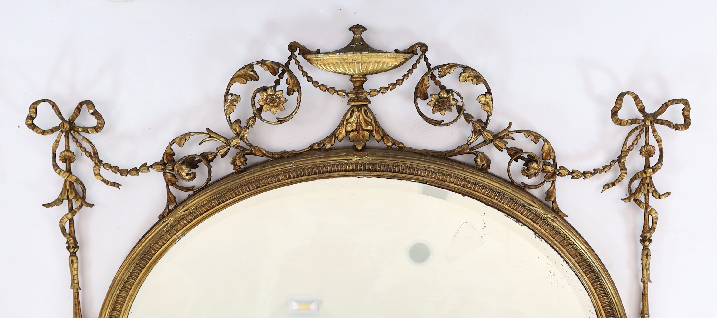 A late Victorian Adam Revival oval wall mirror, with urn, foliate scroll, ribbon and harebell - Image 4 of 6