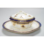 An 18th century Caughley tureen cover and stand with blue and gilt decoration, stand mis-fired to