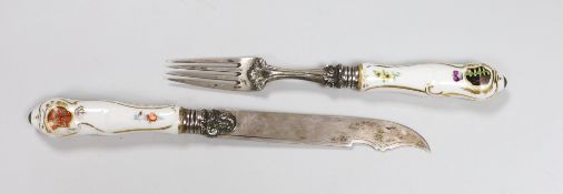 A German porcelain handled silver knife and fork, armorial crests