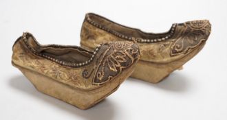 A pair of late 19th century Chinese silk embroidered shoes with Bell inset soles