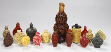 A large Chinese 20th century carved snuff bottle and smaller snuff bottles, all resin